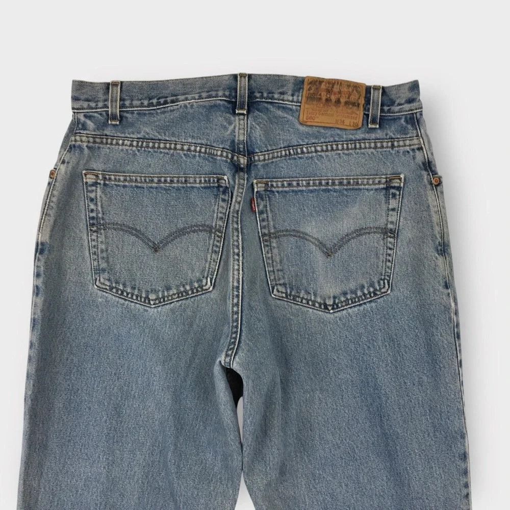 Vintage Levis 560 Jeans Mens size 36x30 Loose Fit Tapered Leg Blue Denim Distres